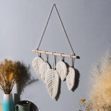 Décoration murale plume en macramé