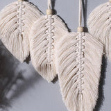 Décoration murale plume en macramé
